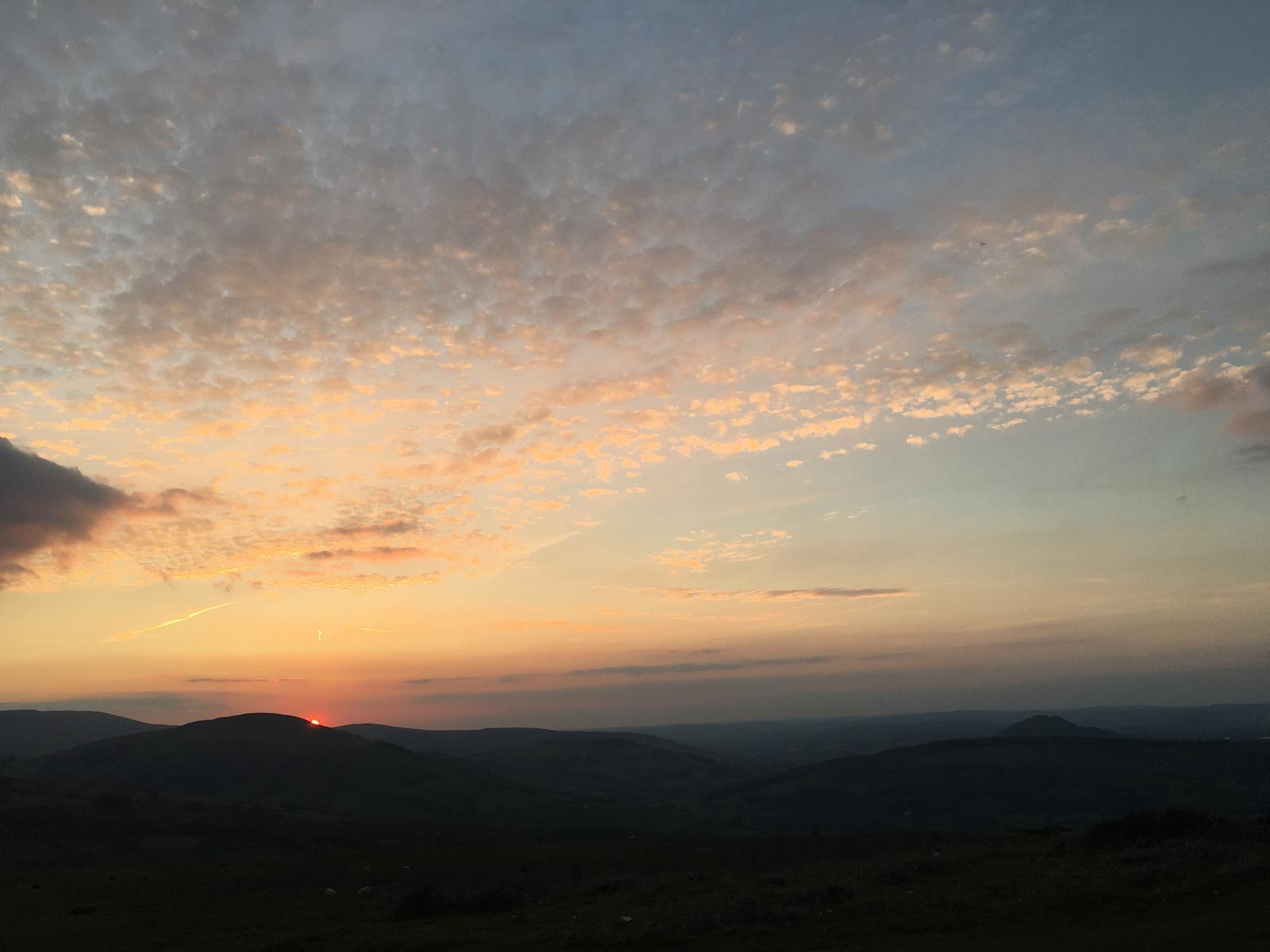 Soft evening sky over distant hills
